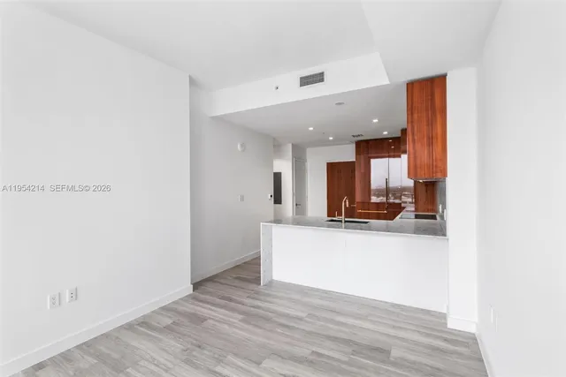 a view of kitchen with wooden floor