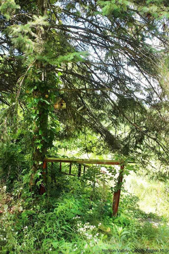 Tbd Mt Zion Road Marlboro, NY 12542 - Photo 8 of 20 a backyard of a house with lots of green space and chair