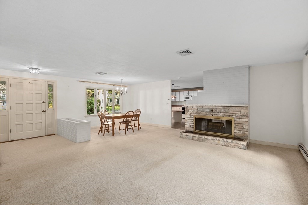 10 Pine Grove Road Hingham, MA 02043 - Photo 13 of 27 an empty room with furniture and a fireplace
