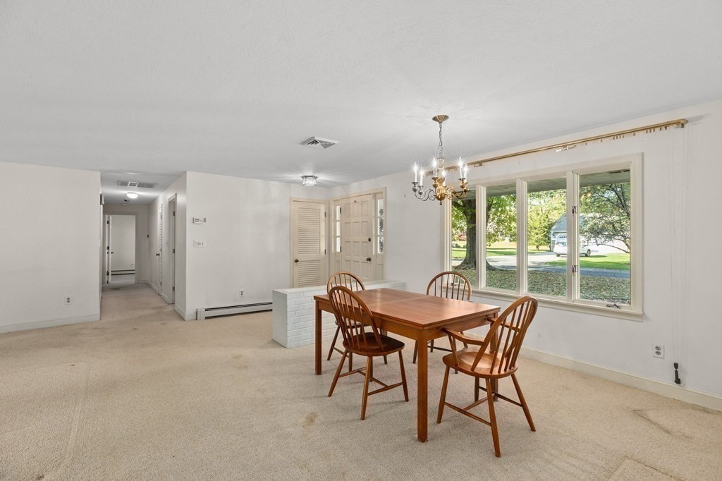 10 Pine Grove Road Hingham, MA 02043 - Photo 15 of 27 a view of a dining room with furniture window and outside view