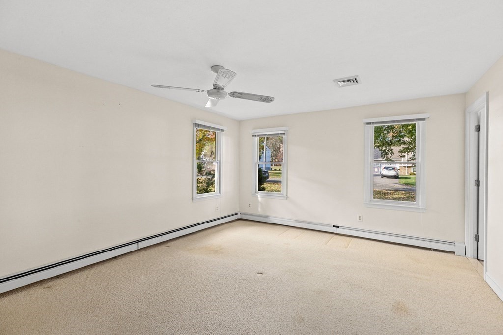 10 Pine Grove Road Hingham, MA 02043 - Photo 17 of 27 an empty room with a empty space and windows