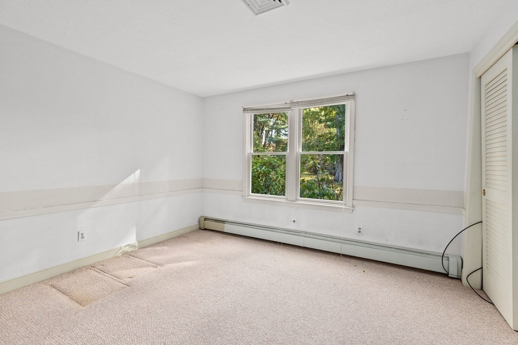 10 Pine Grove Road Hingham, MA 02043 - Photo 19 of 27 an empty room with a empty space and window