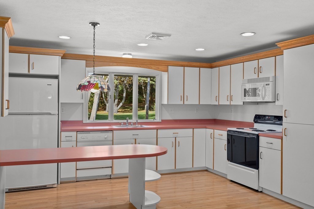 10 Pine Grove Road Hingham, MA 02043 - Photo 2 of 27 a kitchen with stainless steel appliances granite countertop a stove a sink and a refrigerator