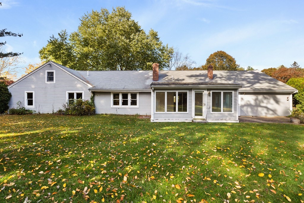 10 Pine Grove Road Hingham, MA 02043 - Photo 26 of 27 a front view of a house with a garden