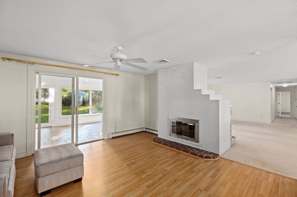 10 Pine Grove Road Hingham, MA 02043 - Photo 7 of 27 a living room with furniture and a fireplace