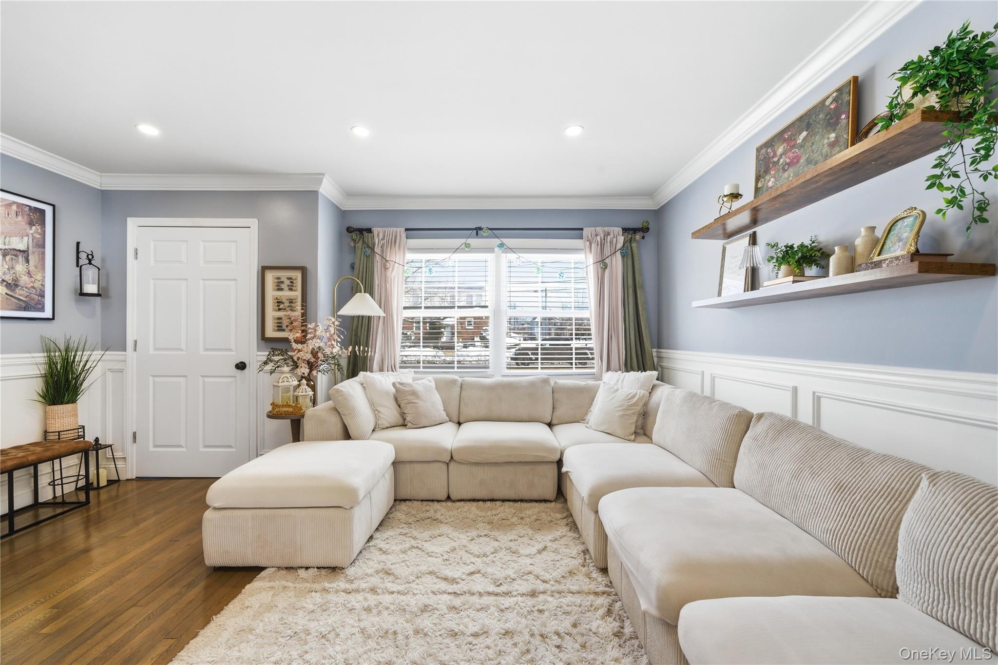 192 Mill Road Valley Stream, NY 11581 - Photo 19 of 26 a living room with furniture and a large window