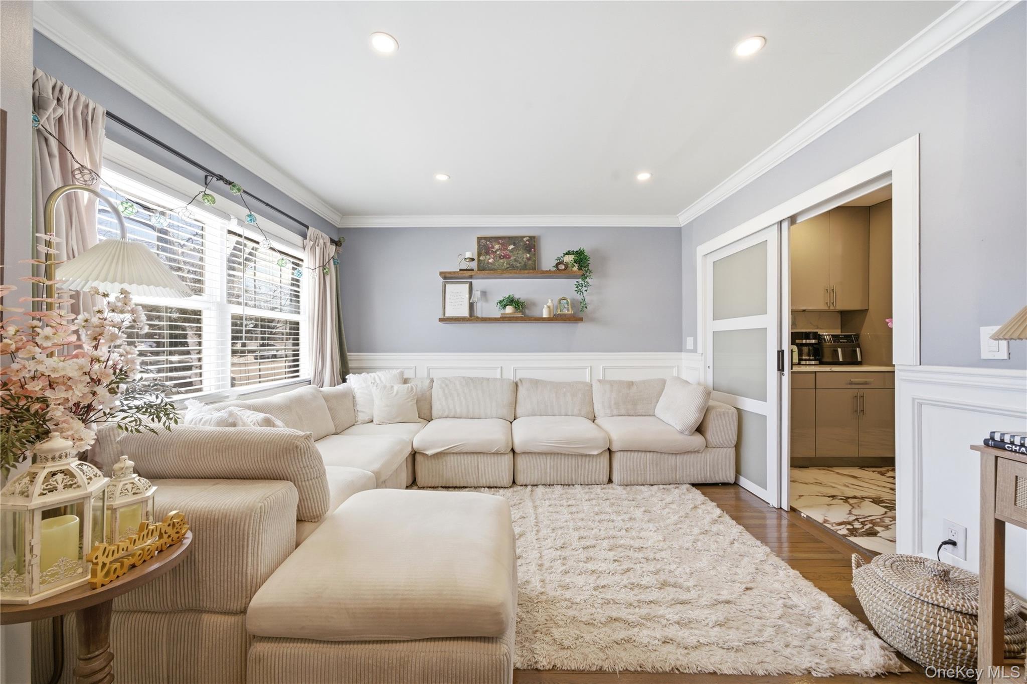 192 Mill Road Valley Stream, NY 11581 - Photo 22 of 26 a living room with furniture and a large window