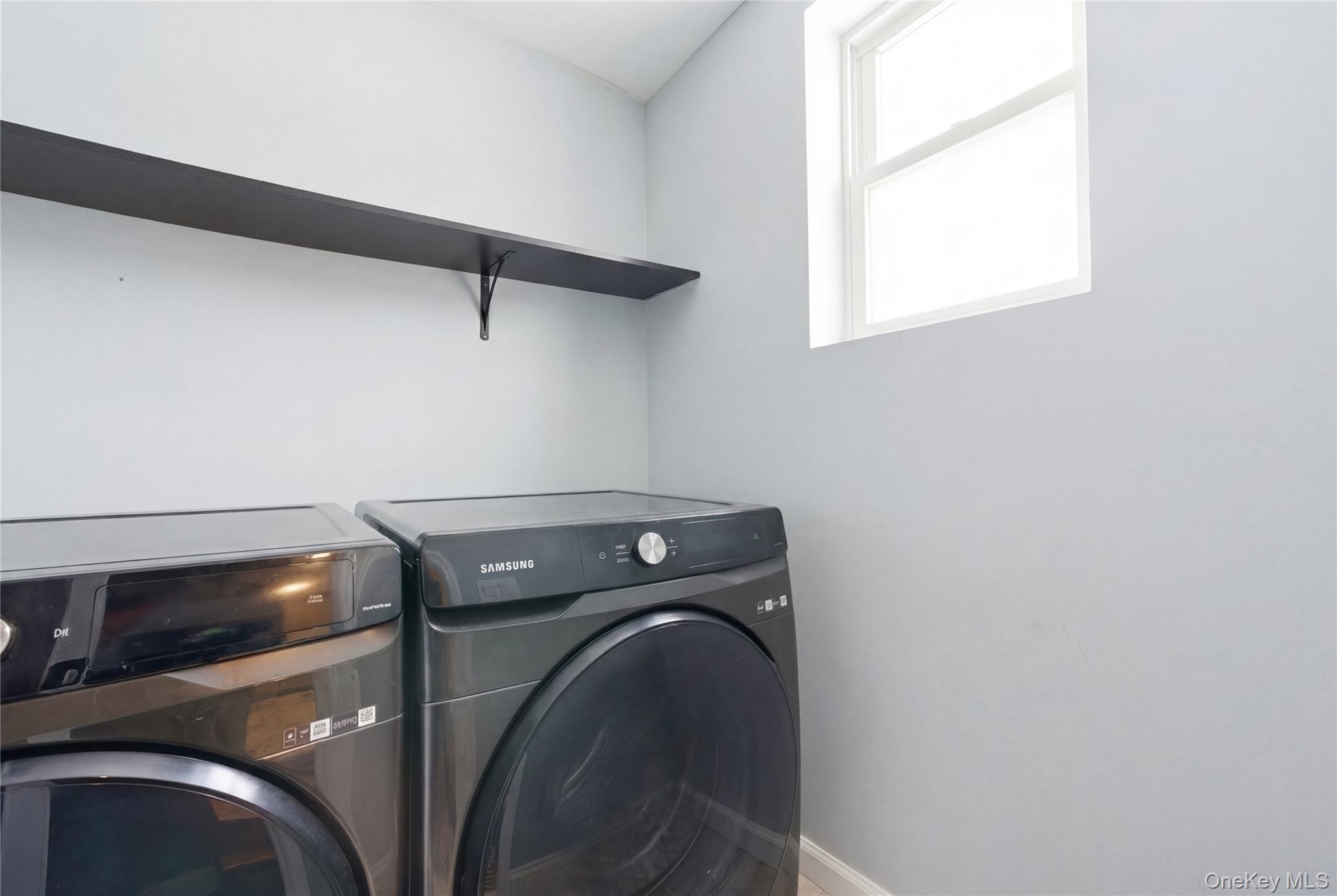 192 Mill Road Valley Stream, NY 11581 - Photo 24 of 26 a utility room with dryer and washer