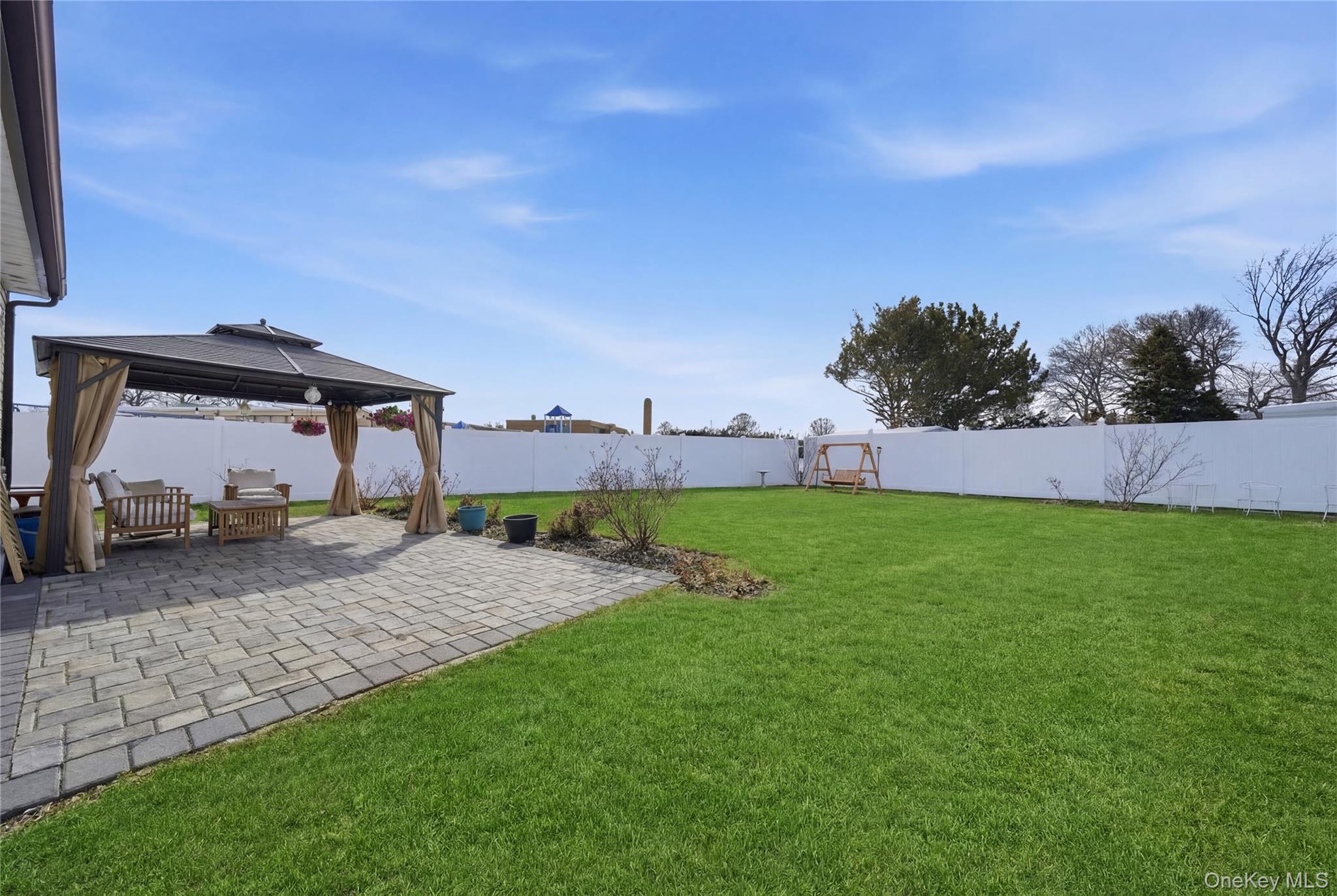 192 Mill Road Valley Stream, NY 11581 - Photo 26 of 26 a view of a outdoor space with a garden