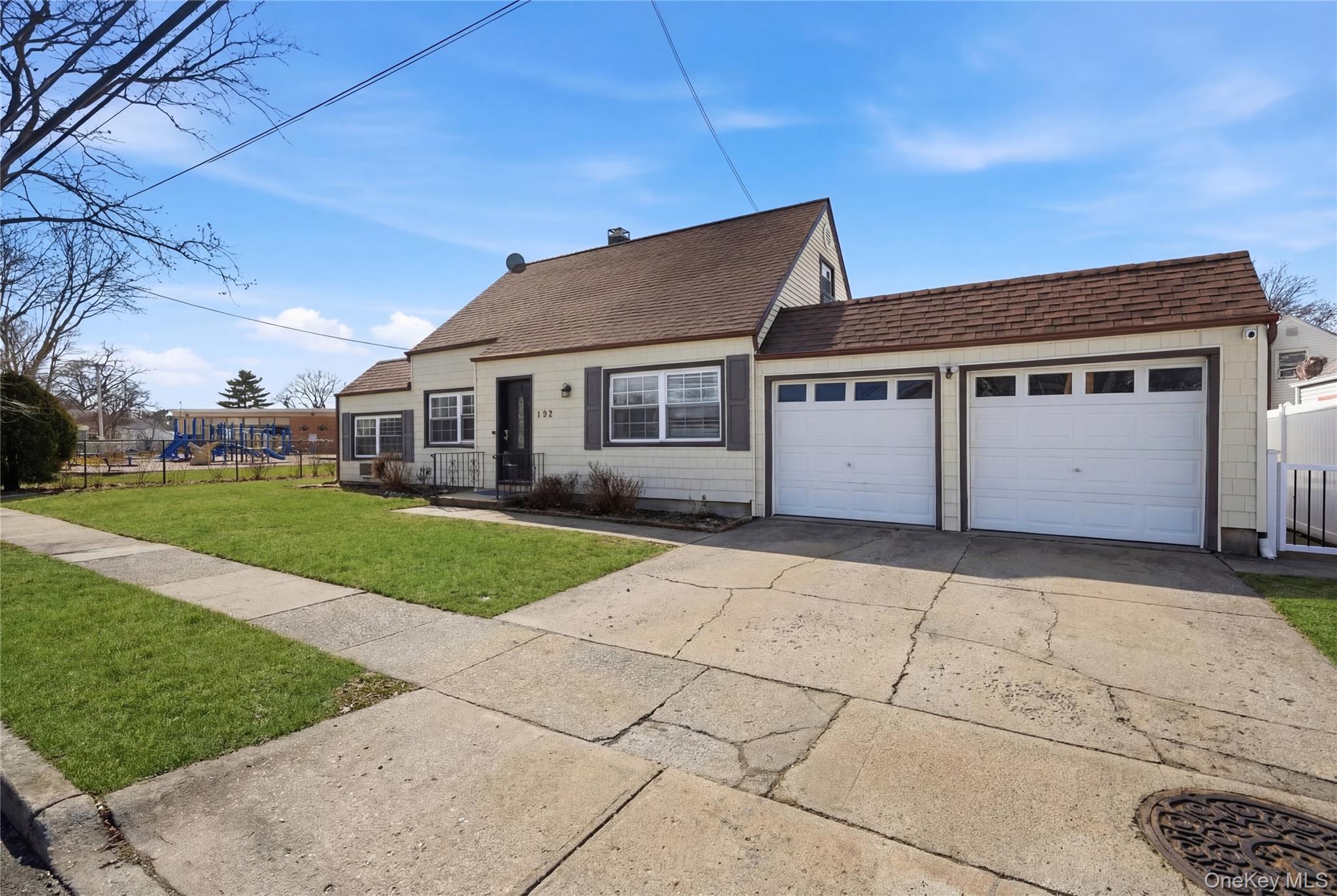 192 Mill Road Valley Stream, NY 11581 - Photo 3 of 26 a front view of house with yard
