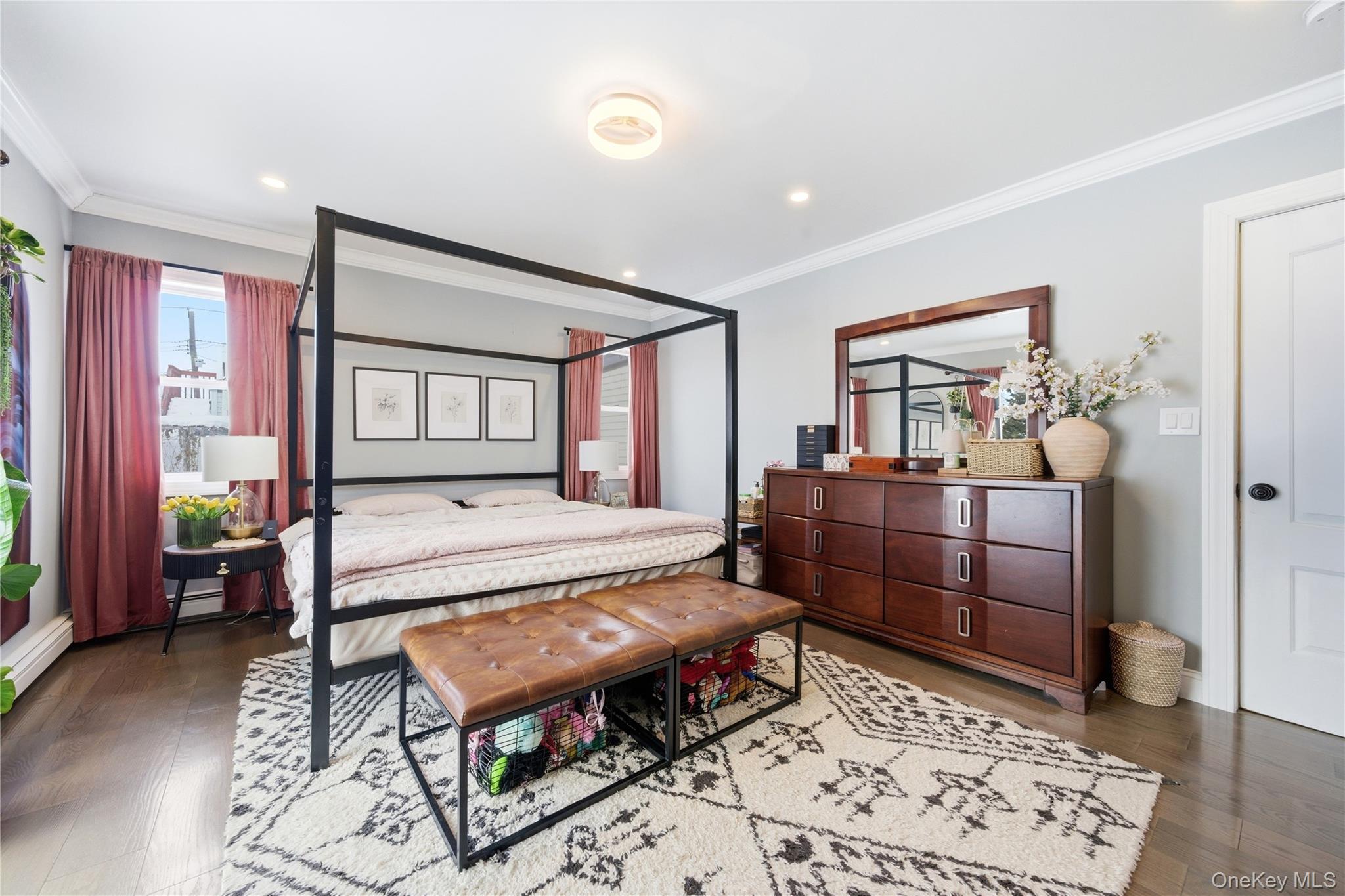 192 Mill Road Valley Stream, NY 11581 - Photo 5 of 26 a bedroom with a bed and wooden floor