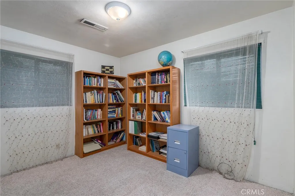 559 East Chico, CA 95928 - Photo 17 of 32 a view of an empty room with a bookshelf and a window