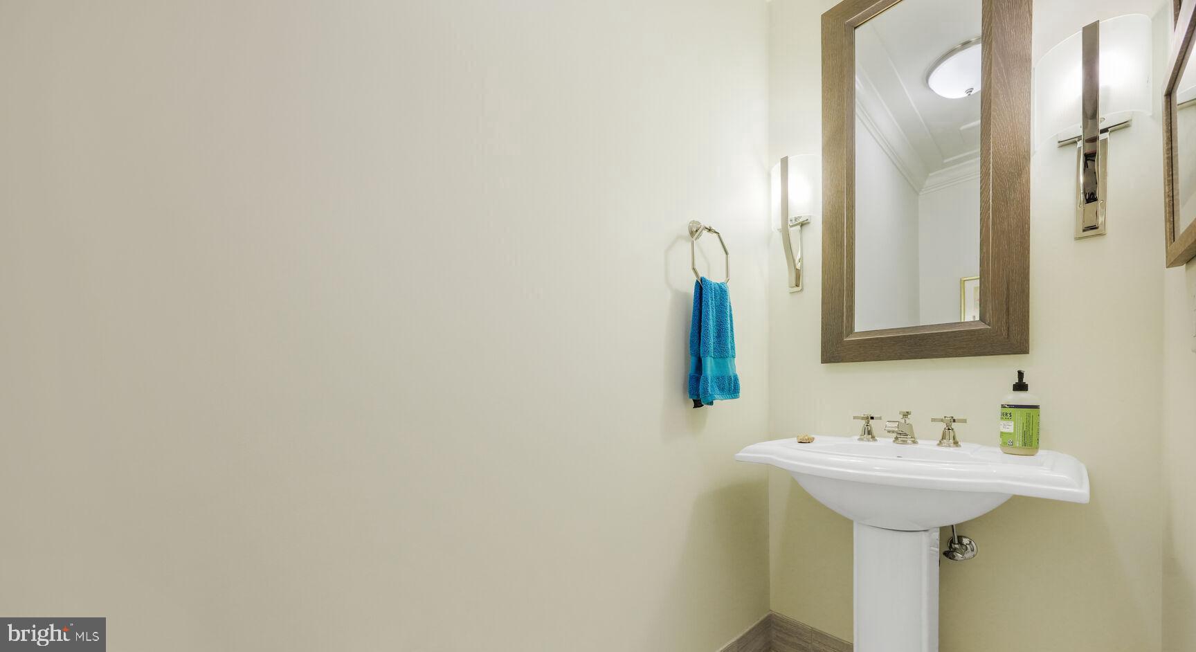 6900 Fleetwood Road, Unit 401 McLean, VA 22101 - Photo 6 of 29 a bathroom with a sink and a mirror