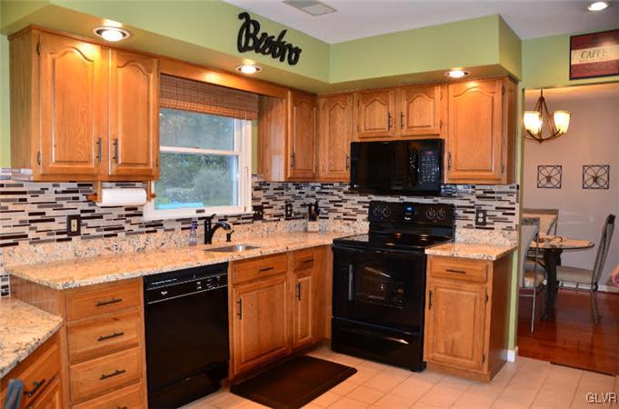 3305 Fischer Road Easton, PA 18045 - Photo 3 of 16 a kitchen with stainless steel appliances a stove sink and microwave