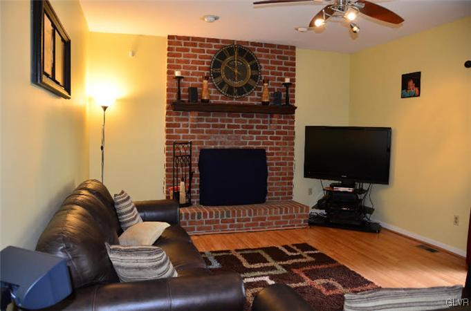 3305 Fischer Road Easton, PA 18045 - Photo 5 of 16 a living room with furniture and a fireplace