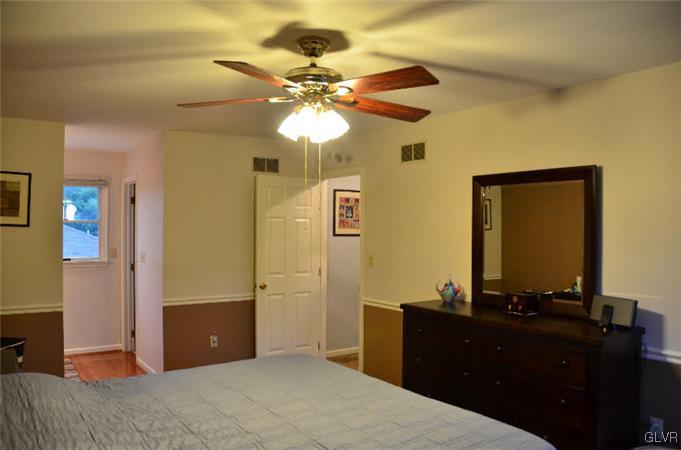 3305 Fischer Road Easton, PA 18045 - Photo 10 of 16 a bedroom with a bed and a dresser