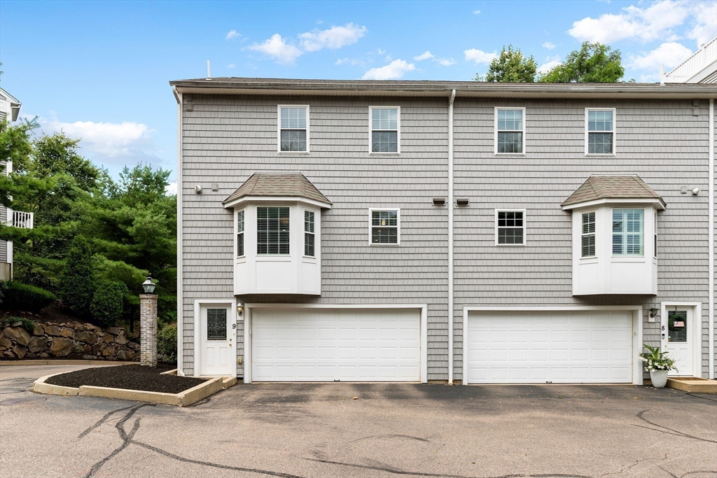 2 Ricciuti Drive, Unit 9 Quincy, MA 02169 - Photo 31 of 40 a front view of a house with a garage
