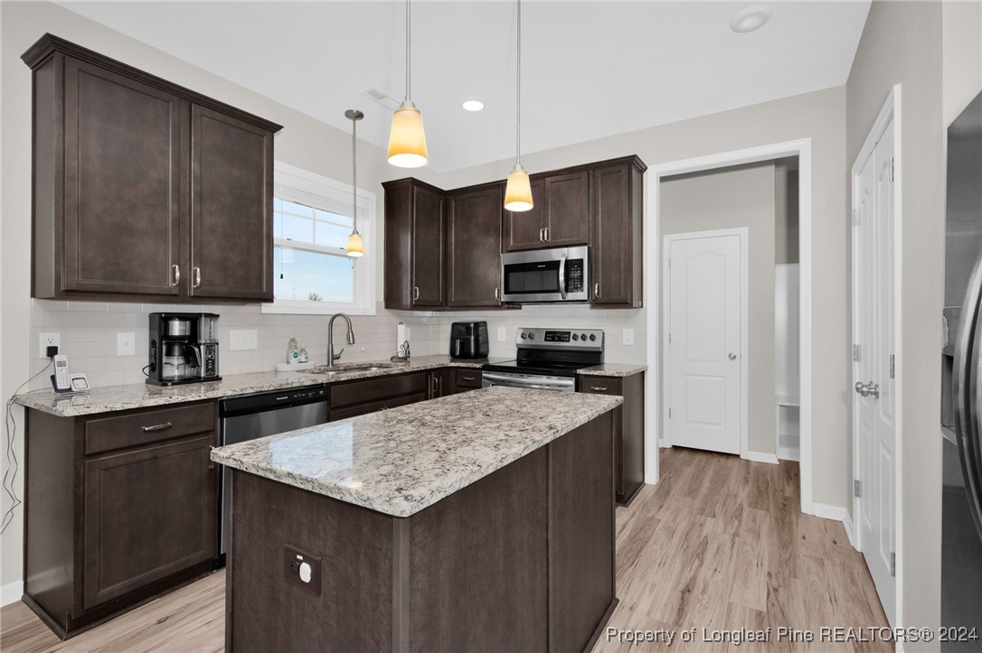 181 Chatfield Dr. Raeford, NC 28376 - Photo 11 of 36 a kitchen with a sink stove top oven and refrigerator