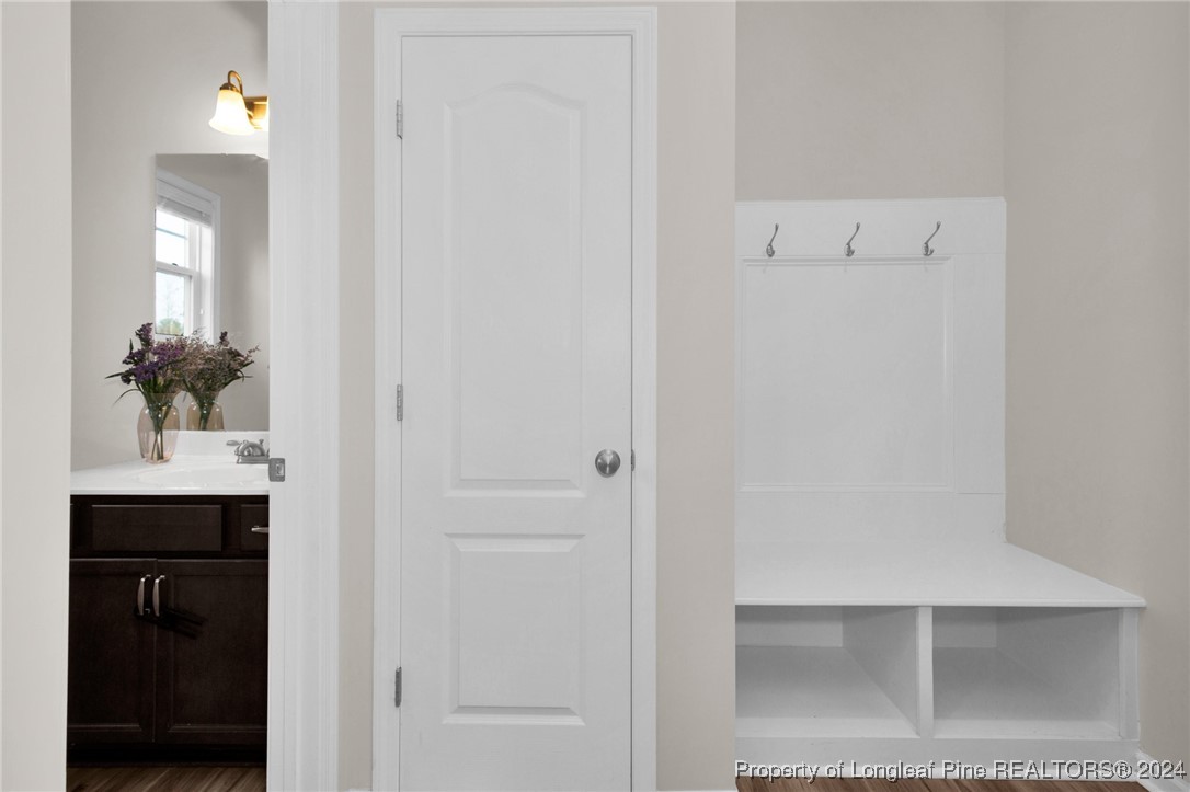 181 Chatfield Dr. Raeford, NC 28376 - Photo 14 of 36 a bathroom with a sink and mirror