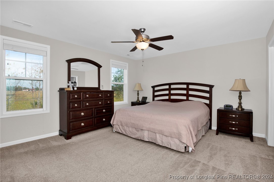 181 Chatfield Dr. Raeford, NC 28376 - Photo 16 of 36 a bedroom with a bed and a closet