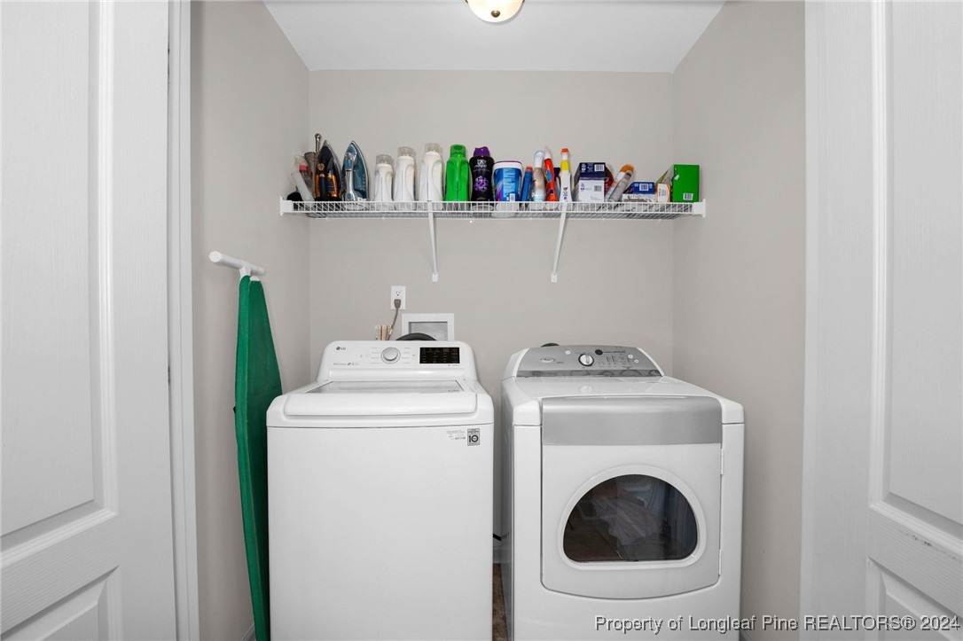 181 Chatfield Dr. Raeford, NC 28376 - Photo 29 of 36 a utility room with dryer and washer