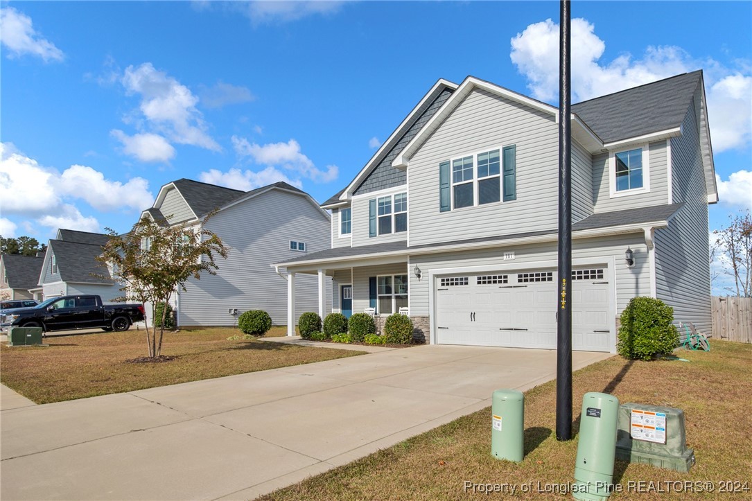 181 Chatfield Dr. Raeford, NC 28376 - Photo 31 of 36 a front view of a house with a garden