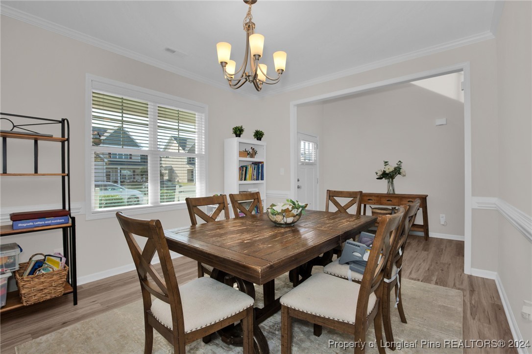 181 Chatfield Dr. Raeford, NC 28376 - Photo 4 of 36 a view of a dining table and chairs in the room