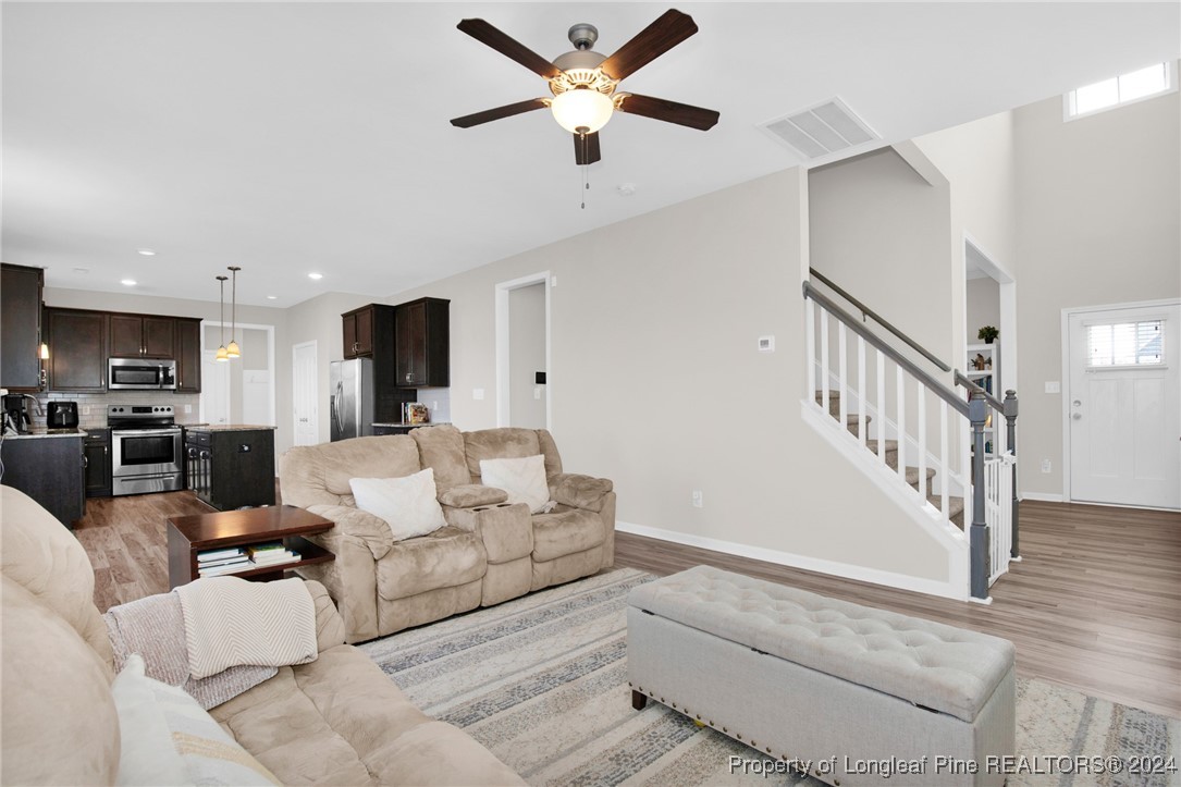 181 Chatfield Dr. Raeford, NC 28376 - Photo 8 of 36 a living room with furniture and kitchen view