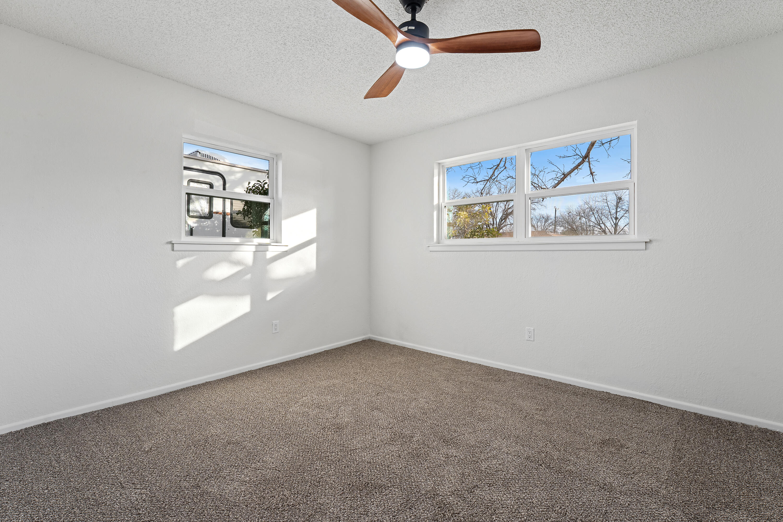 1117 15th Street Shallowater, TX 79363 - Photo 19 of 23 an empty room with windows and cabinet