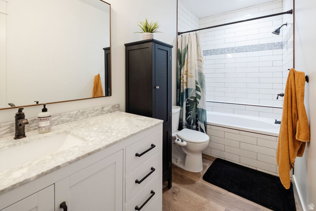924 Country Lane Farmington, UT 84025 - Photo 55 of 91 Bathroom featuring a white vanity with a stone countertop, an undermount sink, and black hardware