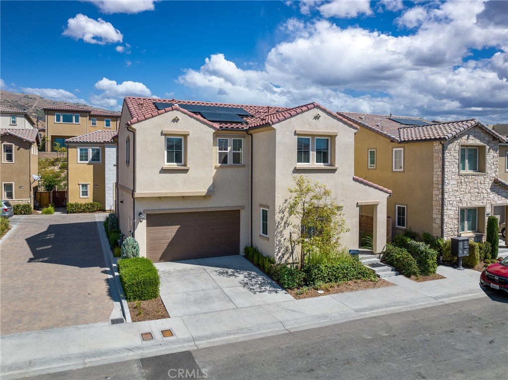 20643 West Chestnut Circle Porter Ranch, CA 91326 - Photo 1 of 1 a front view of a house with a yard
