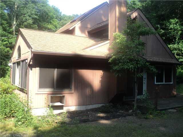 a house with trees in front of it