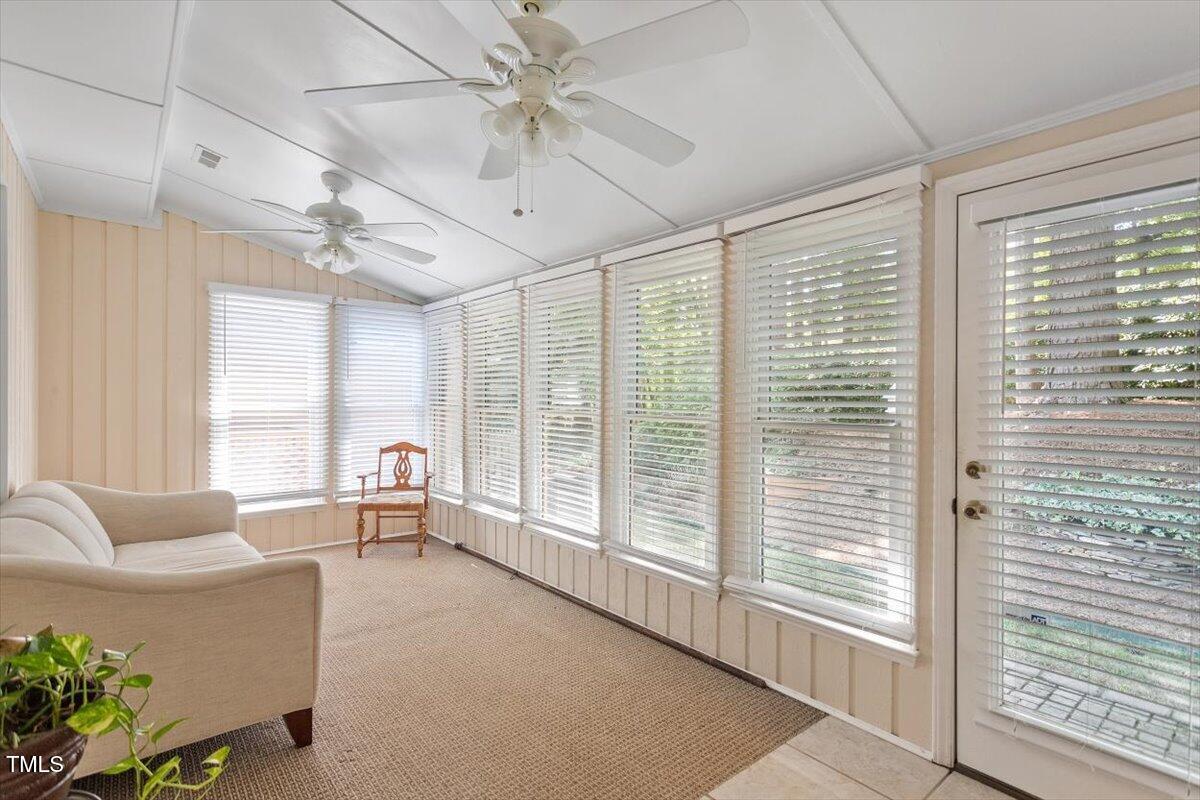 721 Tan Tara Square Raleigh, NC 27615 - Photo 13 of 26 a living room with furniture and a large window