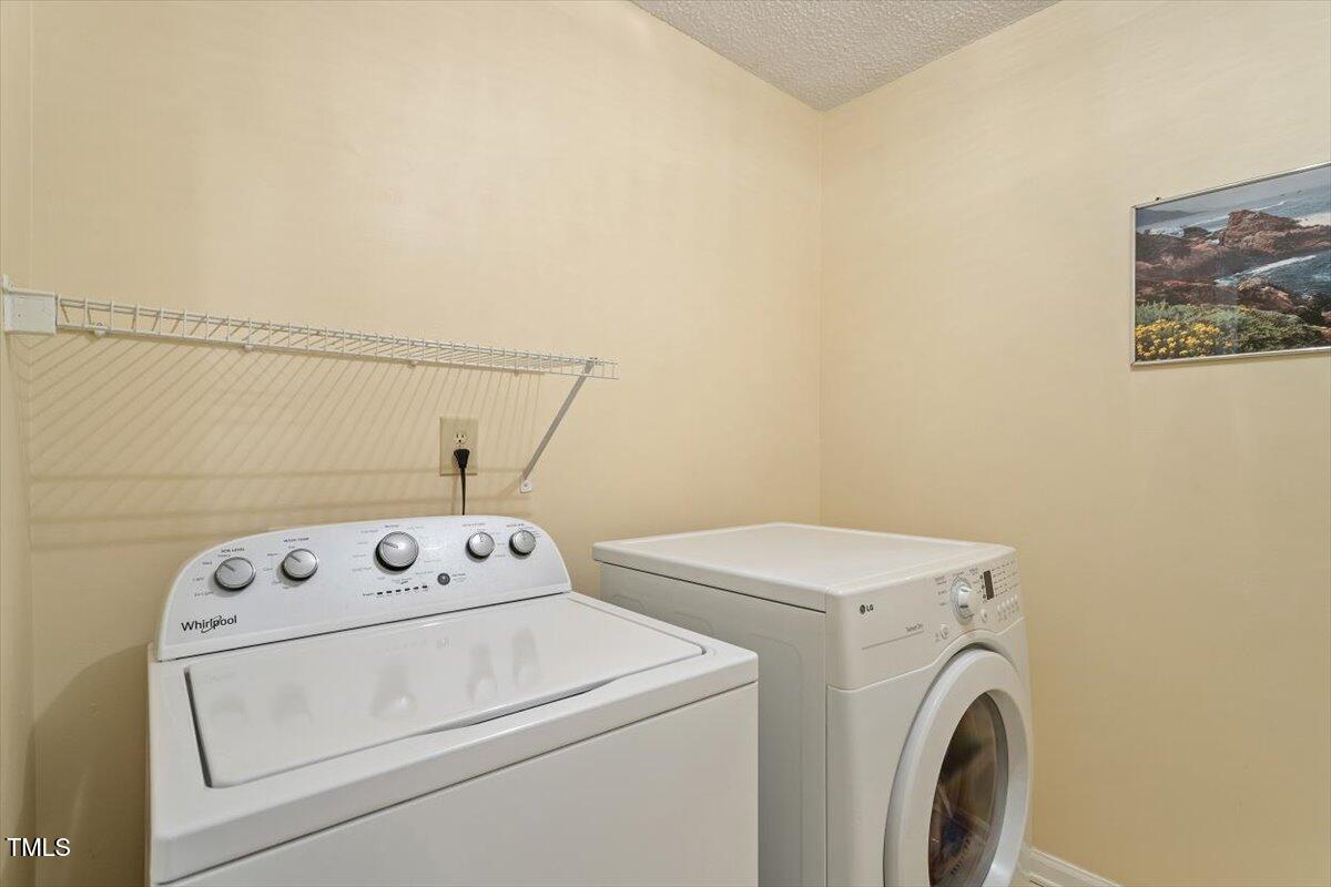 721 Tan Tara Square Raleigh, NC 27615 - Photo 17 of 26 a utility room with dryer and washer