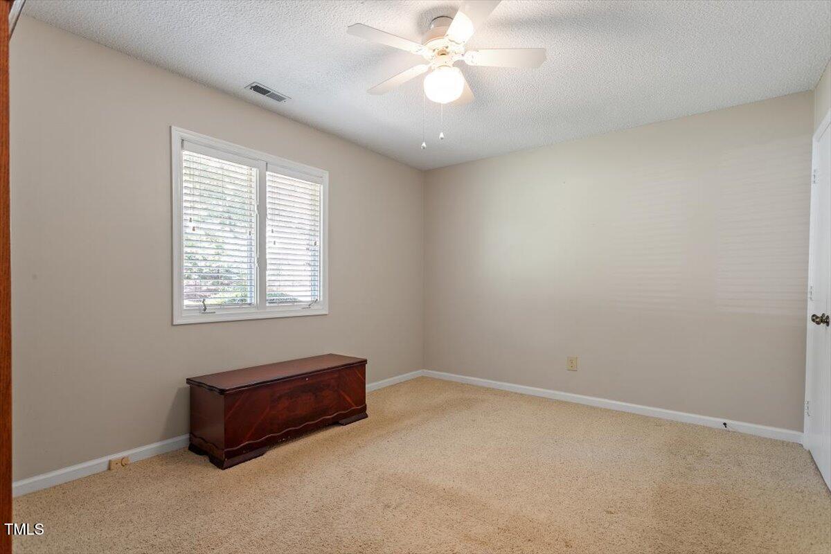 721 Tan Tara Square Raleigh, NC 27615 - Photo 22 of 26 an empty room with windows and fan