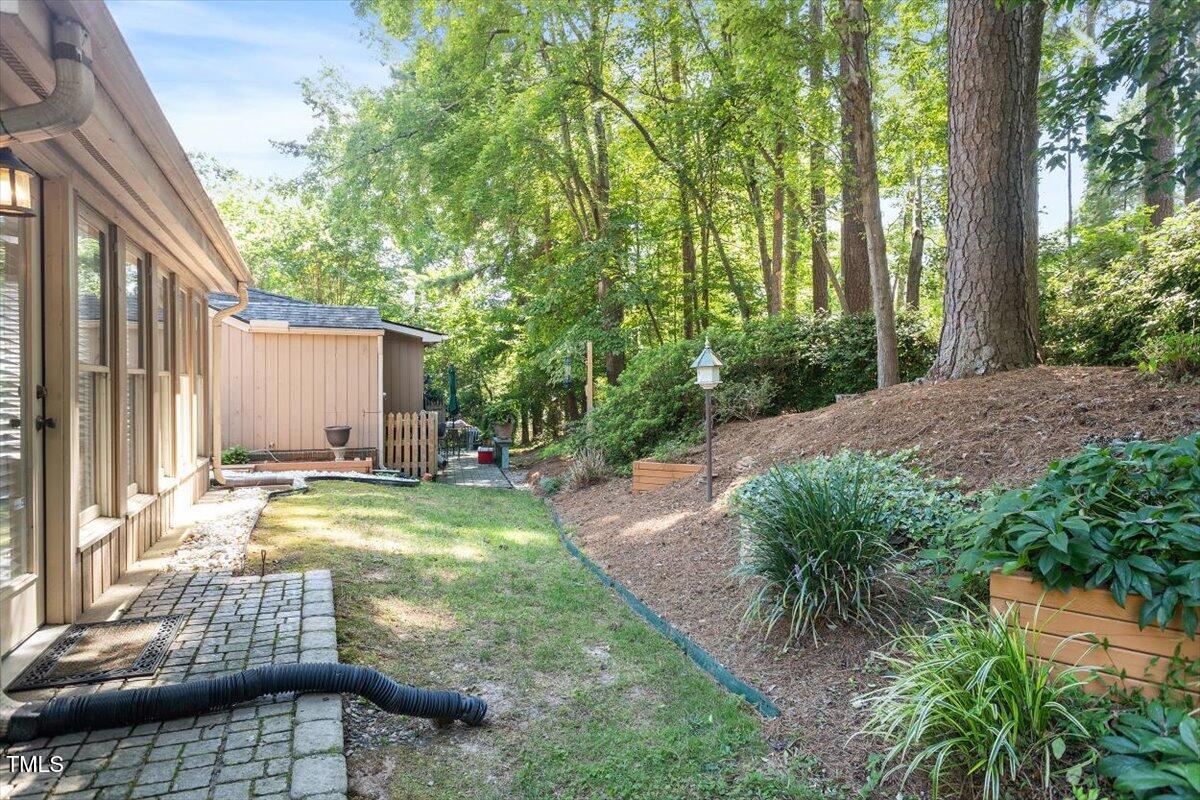 721 Tan Tara Square Raleigh, NC 27615 - Photo 26 of 26 a backyard of a house with yard and outdoor seating