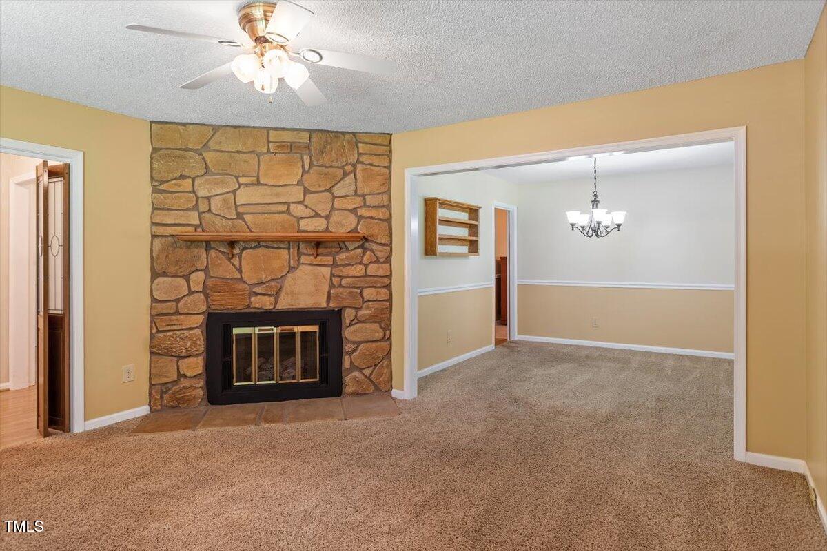 721 Tan Tara Square Raleigh, NC 27615 - Photo 7 of 26 a view of an empty room with a fireplace