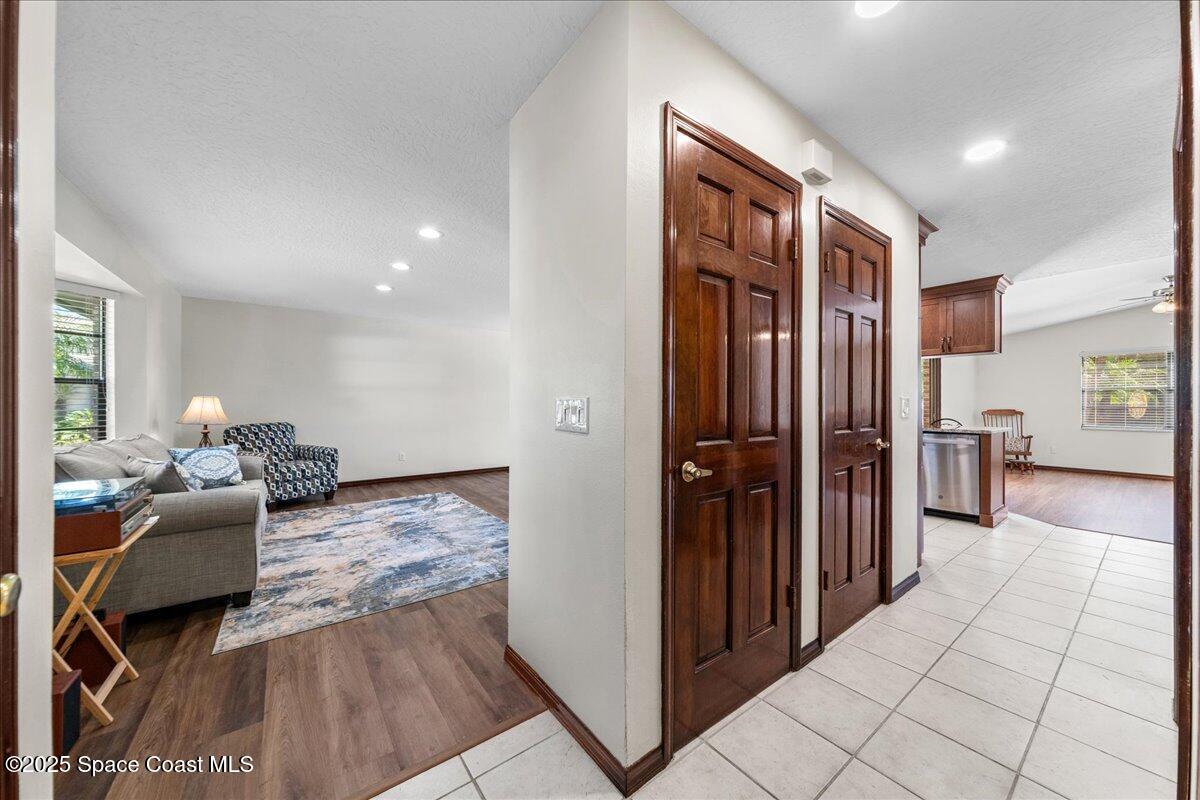 257 Avens Road Northeast Palm Bay, FL 32907 - Photo 11 of 52 a living room with furniture and a fireplace