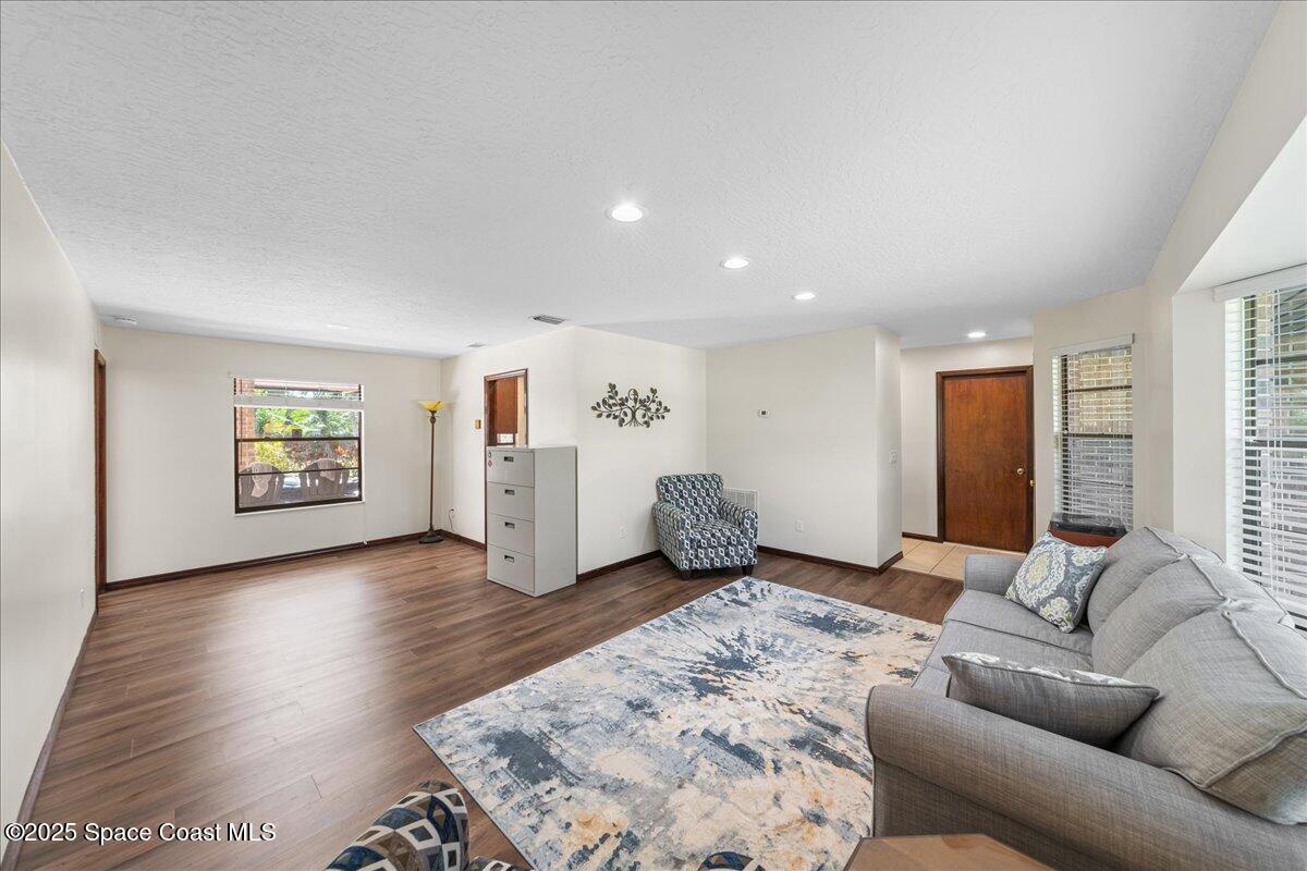 257 Avens Road Northeast Palm Bay, FL 32907 - Photo 13 of 52 a living room with furniture and window
