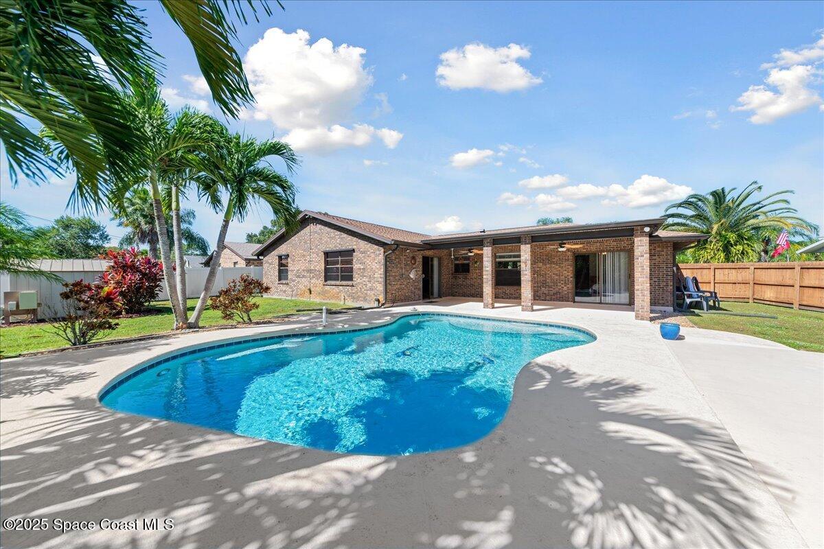 257 Avens Road Northeast Palm Bay, FL 32907 - Photo 26 of 52 a house view with a backyard space