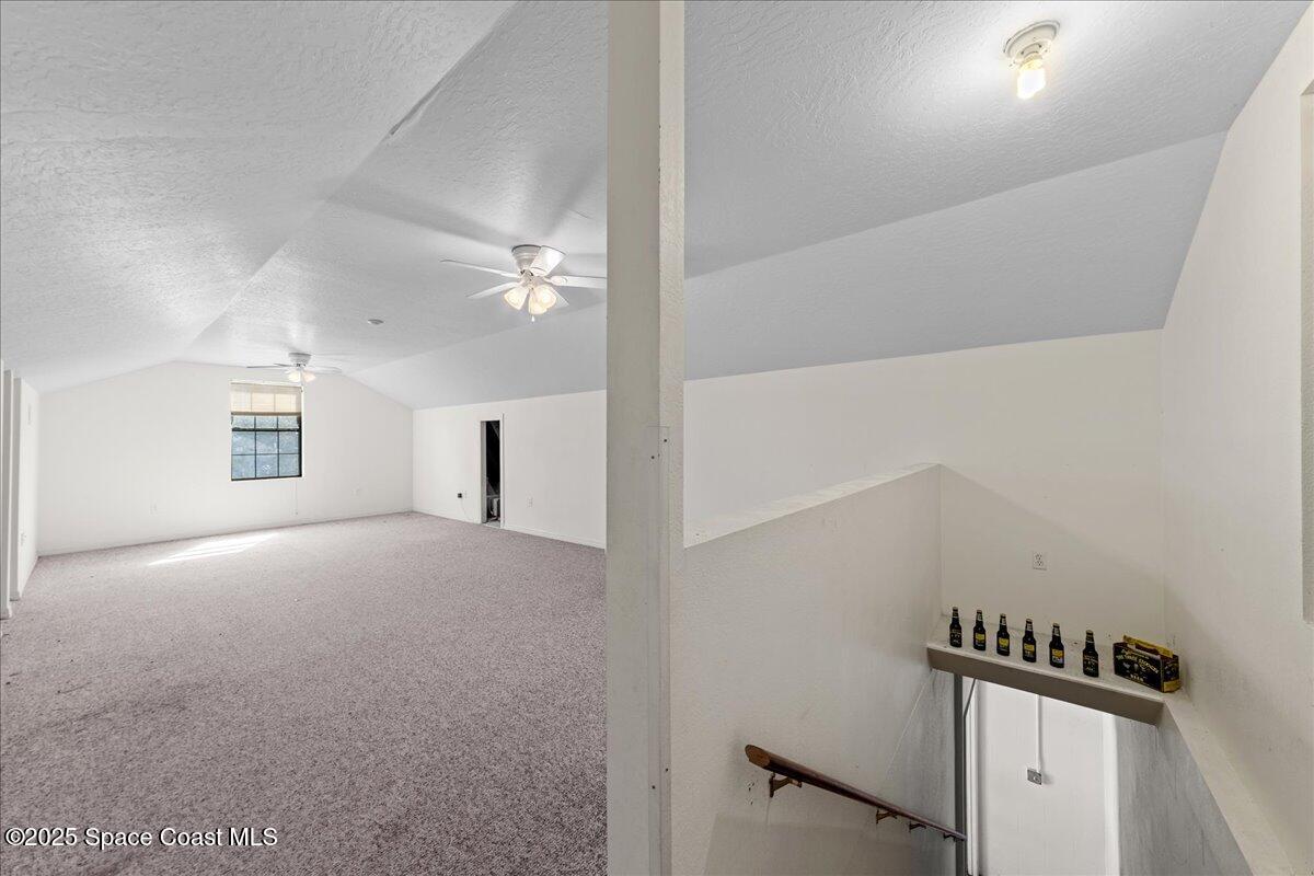 257 Avens Road Northeast Palm Bay, FL 32907 - Photo 33 of 52 a view of a livingroom with a staircase