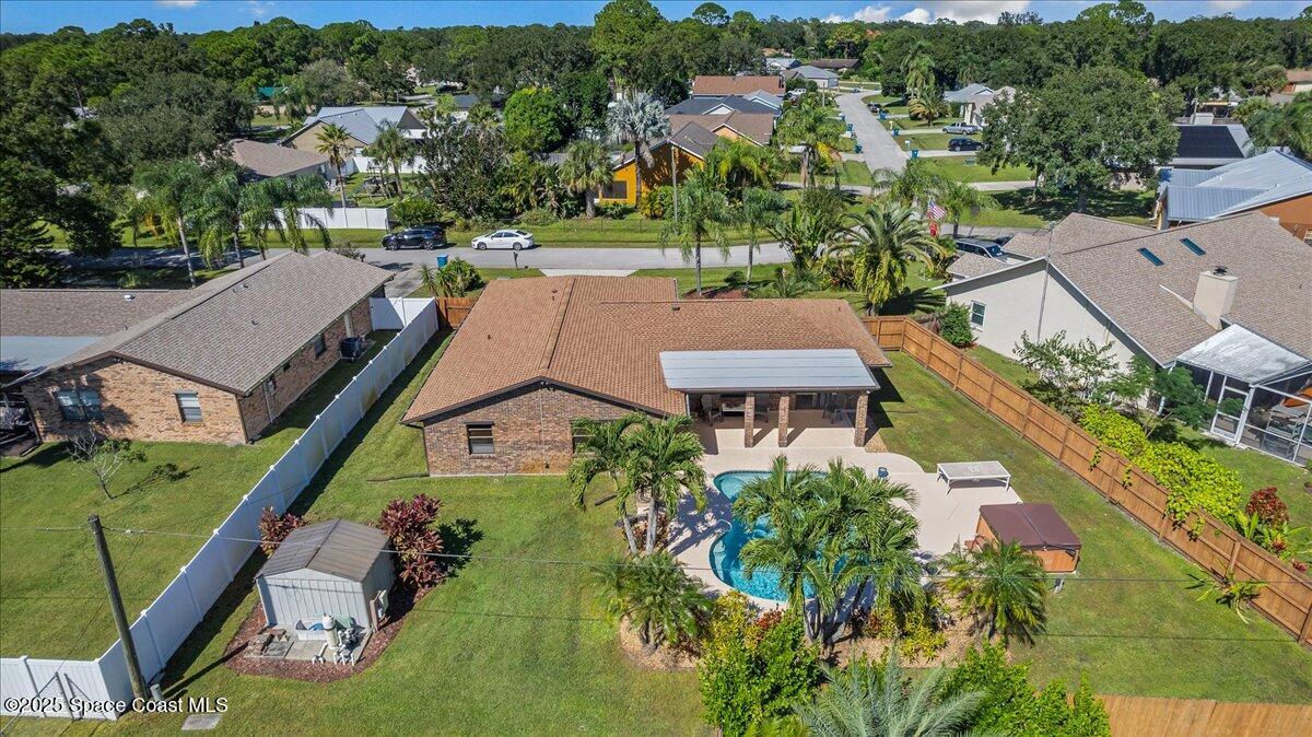 257 Avens Road Northeast Palm Bay, FL 32907 - Photo 35 of 52 an aerial view of a house with a garden