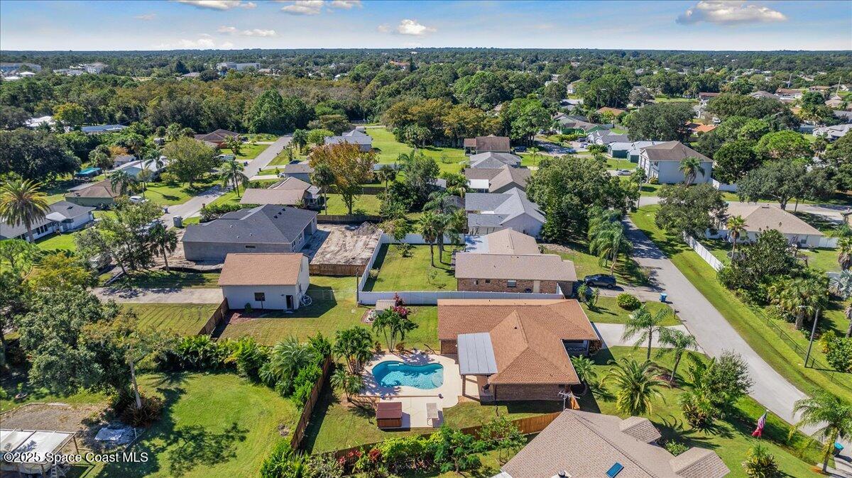 257 Avens Road Northeast Palm Bay, FL 32907 - Photo 36 of 52 an aerial view of a house with a yard