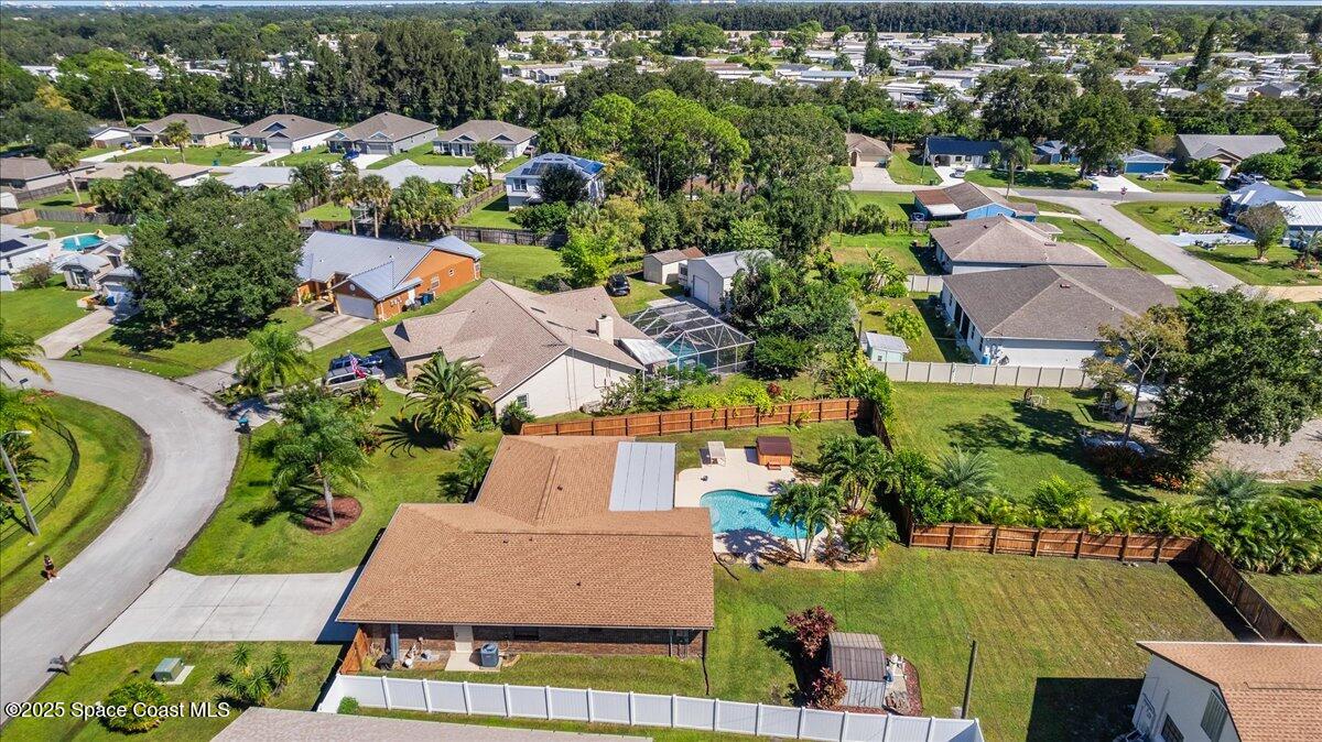 257 Avens Road Northeast Palm Bay, FL 32907 - Photo 43 of 52 an aerial view of residential houses with outdoor space and street view