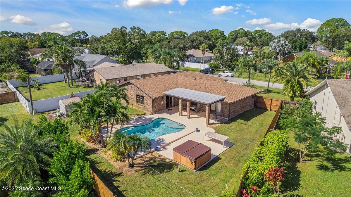 257 Avens Road Northeast Palm Bay, FL 32907 - Photo 46 of 52 an aerial view of a house with swimming pool and garden