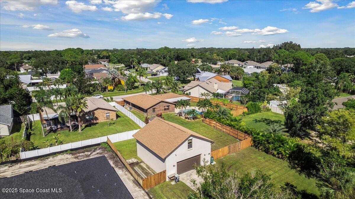 257 Avens Road Northeast Palm Bay, FL 32907 - Photo 47 of 52 an aerial view of a house with a garden