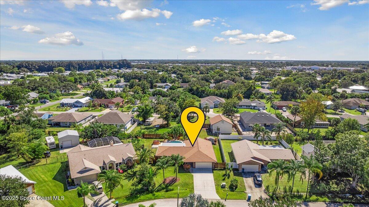 257 Avens Road Northeast Palm Bay, FL 32907 - Photo 48 of 52 an aerial view of residential houses with outdoor space and swimming pool