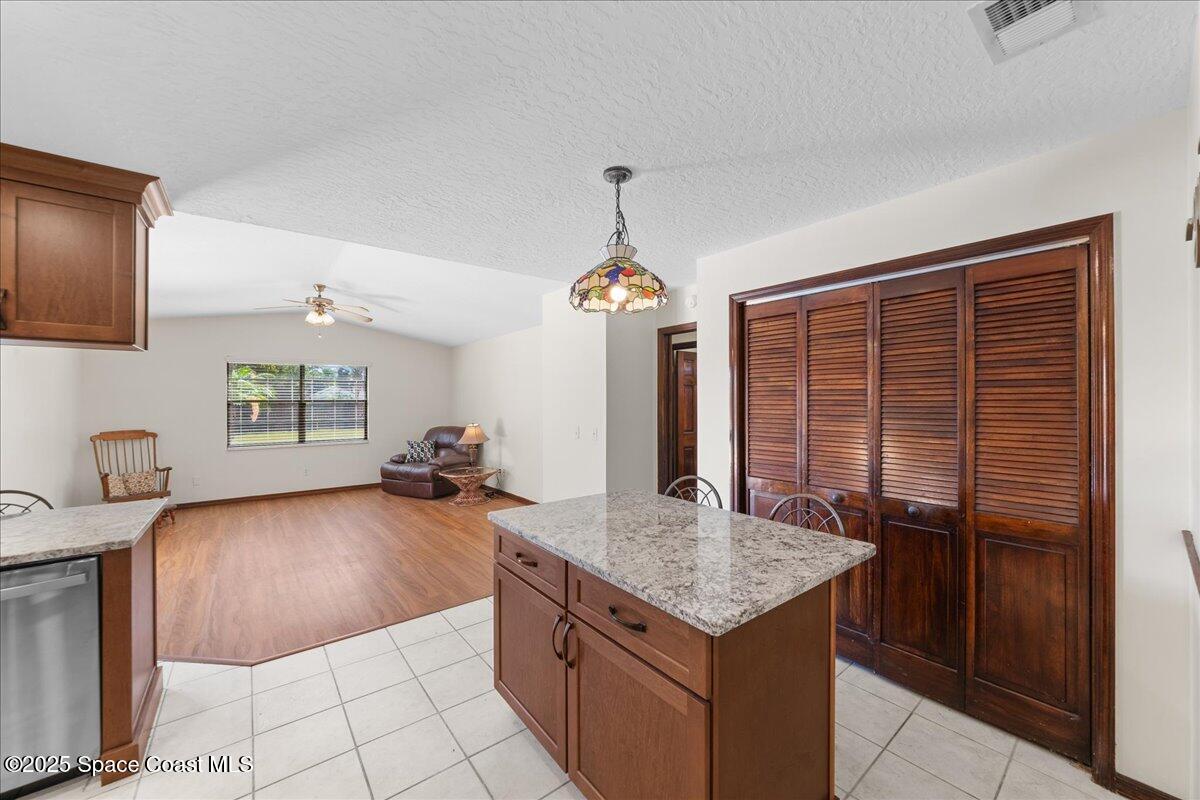 257 Avens Road Northeast Palm Bay, FL 32907 - Photo 9 of 52 a kitchen with sink cabinets and outdoor view