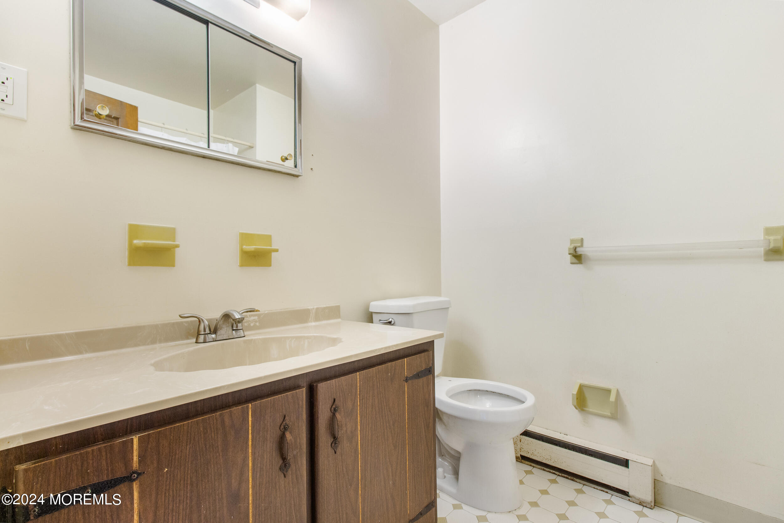 57 Quaker Road Mickleton, NJ 08056 - Photo 26 of 41 a bathroom with a sink a toilet and mirror