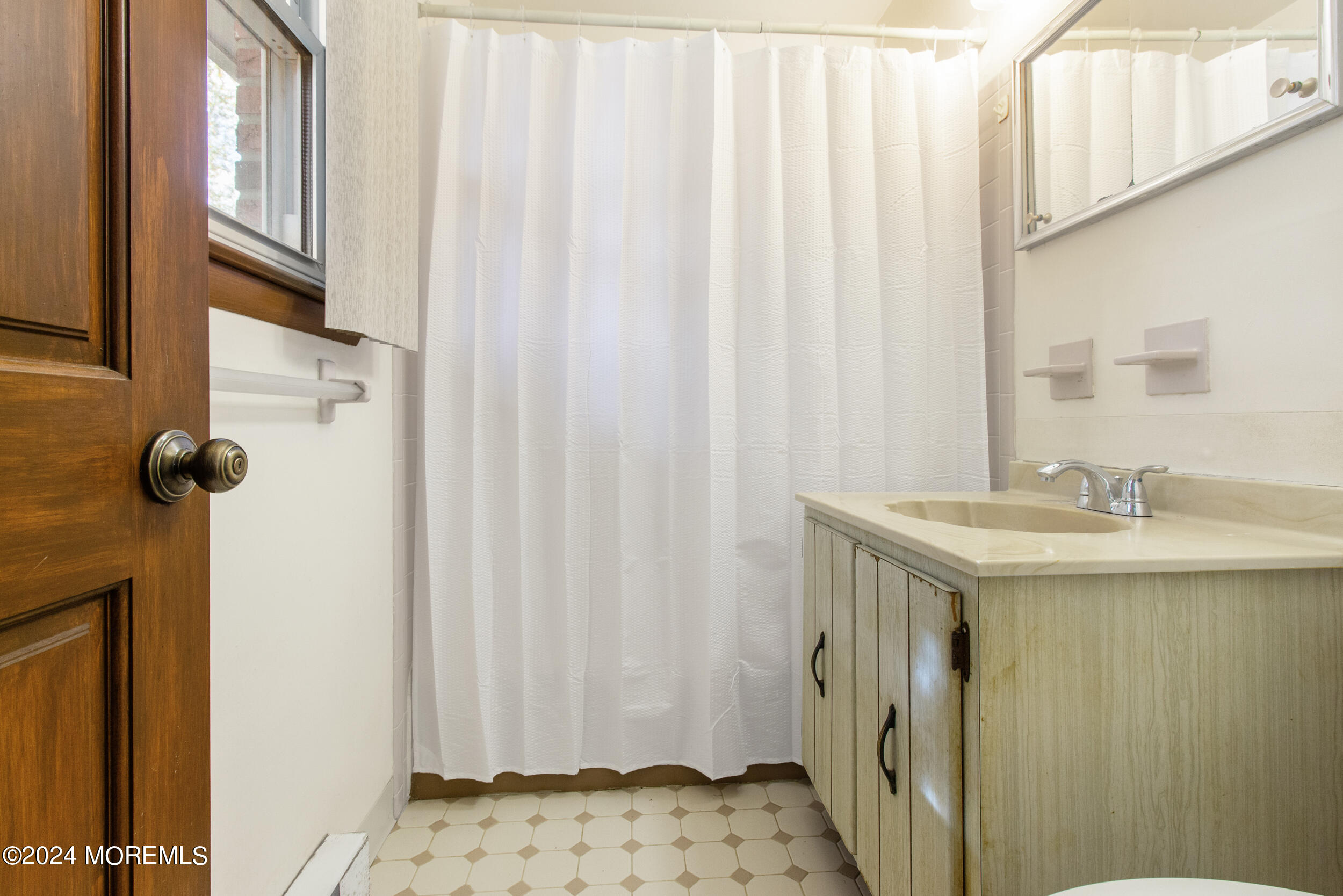 57 Quaker Road Mickleton, NJ 08056 - Photo 35 of 41 a bathroom with a sink and a mirror